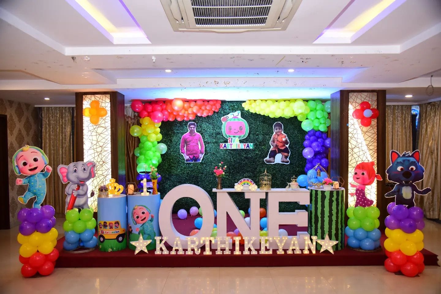 Rainbow Playtime One — A vivid cartoon-themed balloon stage built for Karthikeyan's first birthday.