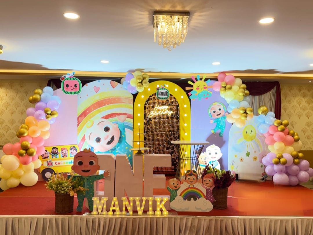 Sunshine Rainbow Stage — Warm pastels, arches and marquee letters for Manvik's first birthday.