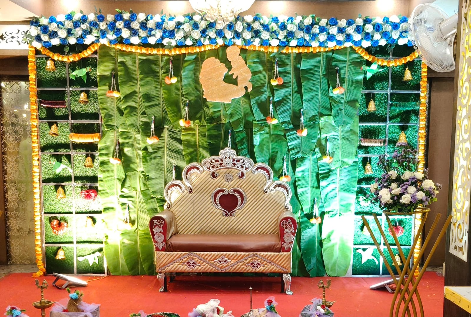 Jungle Dream Shower — A lush green jungle-themed baby shower stage with a royal seat.
